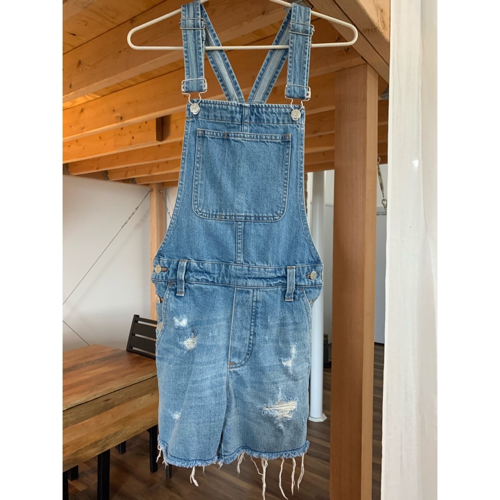 Madewell short denim overalls with raw hem.